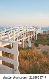 White Wooden Bridge On The Seashore