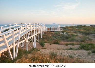 White Wooden Bridge On The Seashore