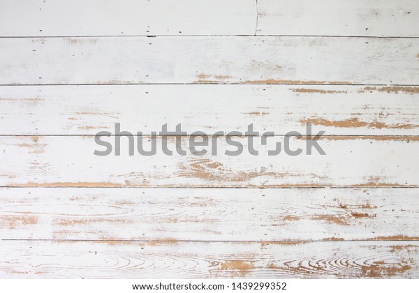 White wooden floorboards. Distressed worn\
floorboard background painted\
white