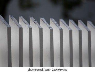 White Wooden Picket Fence Closeup.