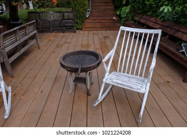white wooden rocking chair in the terrace  - Shutterstock ID 1021224208