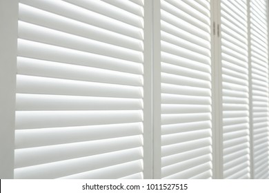 White wooden shutters, White wooden blind.