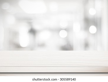 White Wooden Table Top Background Over Bokeh Light, Empty Counter Surface In Blur Room Background, White Wood Shelf, Table  For Retail Shop, Store Product Display, Mock Up,  Template Banner