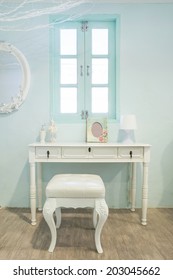 White Wooden Vanity Table With Window In Background