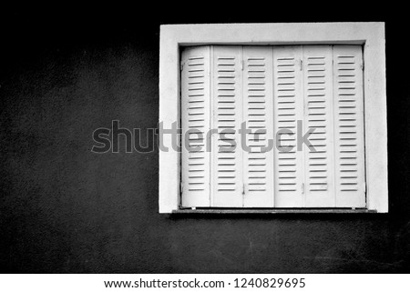 Similar – Two windows with closed shutters