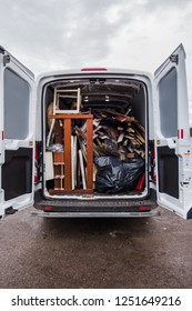 White Work Van Full Of Debris And On Its Way To Recycling