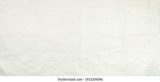 White Woven Plastic Bag Texture Background.  Polypropylene Sack Cloth Surface.