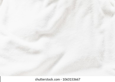 White wrinkle fleece fabric soft texture background, wallpaper, backdrop. Room for text.