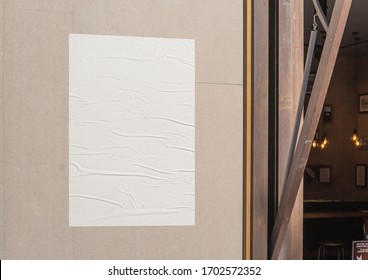 White wrinkled poster template. Glued paper mockup. Blank wheatpaste on textured wall. Empty street art sticker mock up. Clear urban glued advertising canvas.