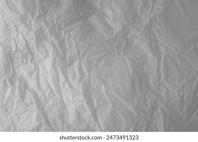 White wrinkled wrapping paper background. Thin subtle paper texture. Grunge backdrop.