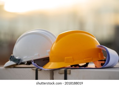 White and Yellow helmet hard hat safety in site construction,concept safety first. - Shutterstock ID 2018188019