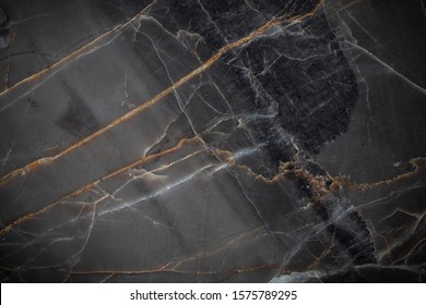 White and yellow patterned natural detailed of dark gray marble (Russia Gold) texture background for interior or product design