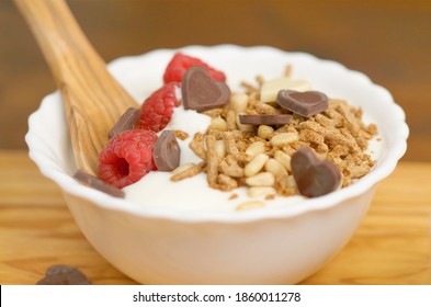 White Yogurt With Honet, Cereal Grain And Fresh Raspberries