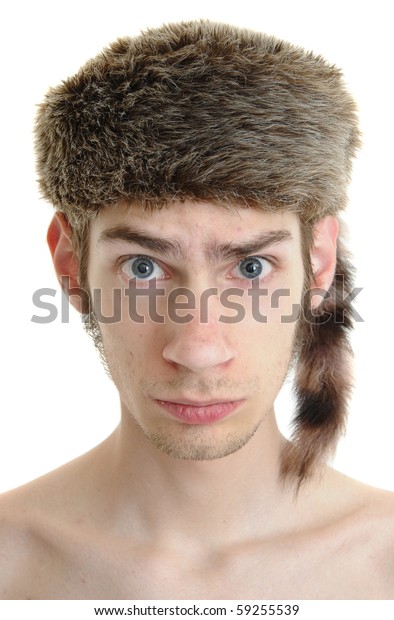 A white young male wears a raccoon hat\
isolated on white background