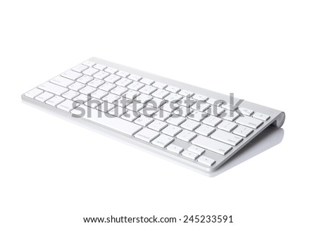 A white(aluminum) keyboard isolated white at the studio. 