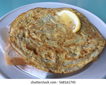 Whitebait Fritter With Bread And Lemon Wedge In New Zealand