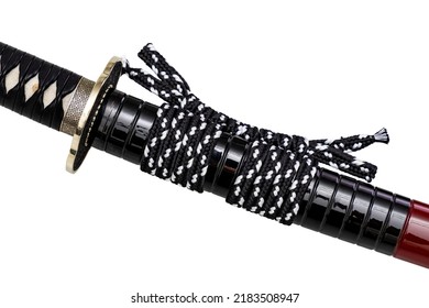 White-Black 'Sageo': silk cord for tying. Shining black Japanese scabbard isolated on a white background. Selective focus.