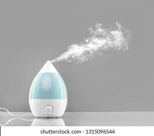 White-blue air humidifier. The unique design quickly and effectively eliminates dry air, providing an optimal level of humidity in the room.