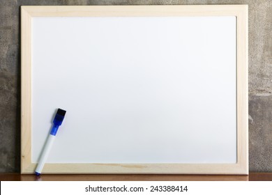 Whiteboard And Marker On Cement Wall Background