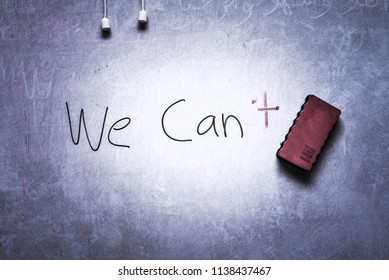 Whiteboard With Note 'We Can't' On It And The Magnetic Duster. Images Have Excessive Grains