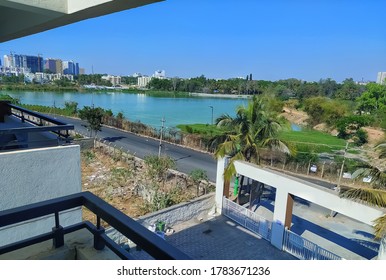 Whitefield,bengaluru,India-22 July 2020:view Of A Lake And Greenery From Balcony During Lockdown.the View Contains Beautiful Lake Building And Greenery.corona Pandemic.stay Home Stay Safe.