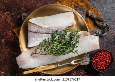 Whitefish Fillet, Raw Haddock Fish On Plate With Rosemary And Thyme. Dark Background. Top View.