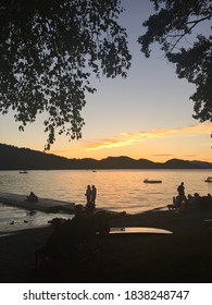 Whitefish, Montana/United States - July 4, 2017: Whitefish lake on a beautiful summer evening, as gatherers prepare to watch the fireworks on the lake.