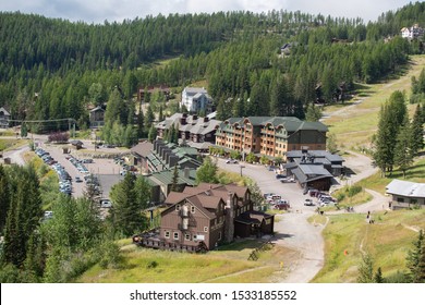 Whitefish Resort, MT / USA - August 19 2019: Mountain ski resort, aerial view during summer day.