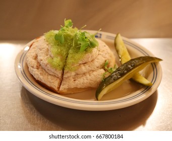 Whitefish Salad On Bagel Toast With Wasabi-infused Fish Roe And Pickles Served In New York Deli