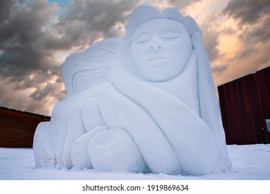 WHITEHORSE, YUKON, CANADA - 22nd February 2018 - Snow Carving - Amazing Snow Carving Sculpture Of An Inuit, First Nations Woman Style Artwork. Carved From Snow In Northern Canadian Town. 