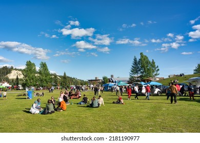 Whitehorse, Yukon, Canada - July 21, 2022: Beautiful sunny weather, Shipyards Park gathers a lot of people visiting the local Fireweed Community Market and having a picnic on the grass