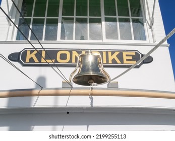 Whitehorse Yukon Territory - August 3 2008; Brass Ships Bell With Sun Flare Below Boat Name Klondike.