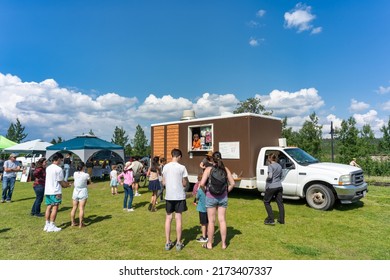 Whitehorse, Yukon Territory, Canada - Jun 30, 2022: People visiting the local Fireweed Community Market during Canada Day long weekend