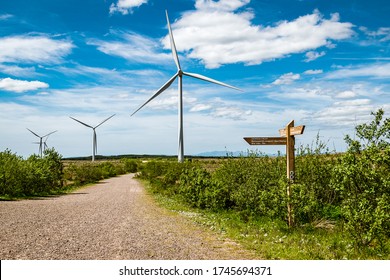 Whitelee Windfarm, Eaglesham Moor, Scotland - May 30, 2020: Walking trail and wind turbines on Whitelee wind farm on a  sunny day.