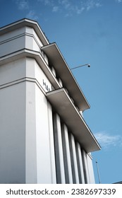 A white-painted building with a vertical line pattern