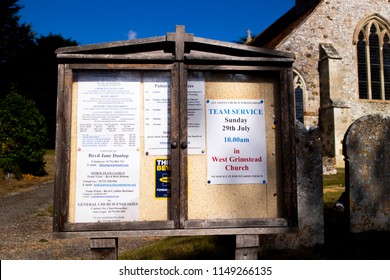 Whiteparish, Wiltshire, England - July 31, 2018: Notice Board At All Saints Parish Church In The Church Of England Diocese Of Salisbury, Building Dating Back To Circa 1190