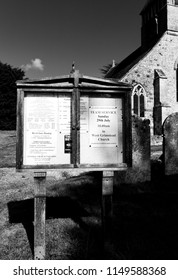 Whiteparish, Wiltshire, England - July 31, 2018: Monochrome Notice Board At All Saints Parish Church In The Church Of England Diocese Of Salisbury, Building Dating Back To Circa 1190