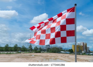 The White-red Chess Flag On The Racetrack.