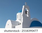 Whitewashed Agios Nikolaos church with blue dome standing against a bright blue sky. Famagusta District, Protaras, Cyprus