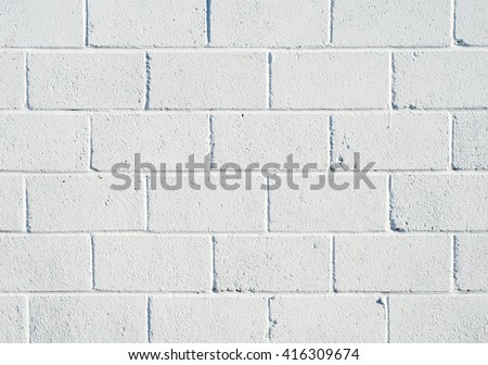 Whitewashed breezeblock wall close up.