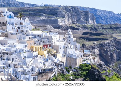 Whitewashed buildings with colourful accents rise against rugged cliffs on Santorini, Greece. Nestled on a hillside, the iconic architecture contrasts with the volcanic landscape. - Powered by Shutterstock