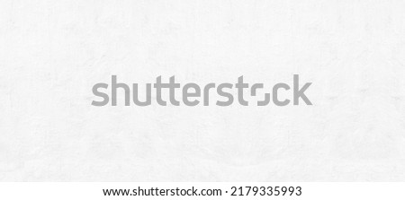 Whitewashed old concrete wall texture. White painted rough cement surface. Light abstract grunge background