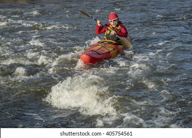 Whitewater Kayaker Paddling Upstream The River Rapid