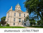 Whitley County Courthouse entrance with steps leading to front doors on bright summer day