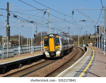 WHITTLESFORD, CAMBRIDGESHIRE/UK - March 19, 2018. Greater Anglia Class 379 Leaves Whittlesford Parkway Station, Cambridgeshire, England.