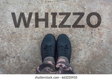 Whizzo, British Slang For Superb And Excellent With Brand New Modern Tennis Shoes On Concrete Sidewalk