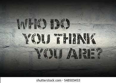 who do you think you are question stencil print on the grunge white brick wall