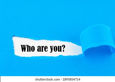 Who Are You? Question Written Under Torn Paper.