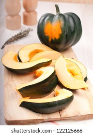 Whole Acorn Squash And Cut Pieces Vertical