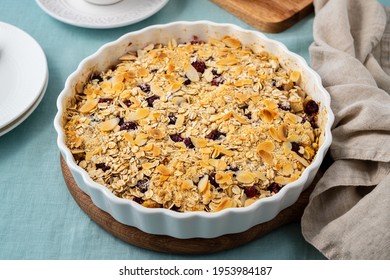 Whole Apple And Pear Crumble With Ice Cream, Streusel. Sweet Dessert With Stewed Fruit Topped Crisp Crumbly Mixture Served Ice Cream. Apple Cobbler Pie In Baking Dish On Tablecloth. Side View